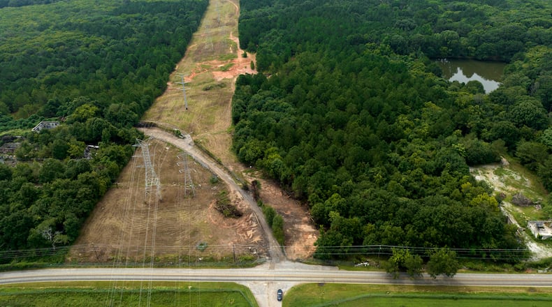 August 9, 2022 Atlanta - Aerial photograph shows the site of the proposed Atlanta public safety training center at the site of the old Atlanta prison farm in Atlanta on Tuesday, August 9 2022. Key Road shows in foreground. A growing number of southeast Atlanta neighborhoods are speaking out against the proposal to build a massive training center for police officers and firefighters on forested land in DeKalb County. (Hyosub Shin / Hyosub.Shin@ajc.com)