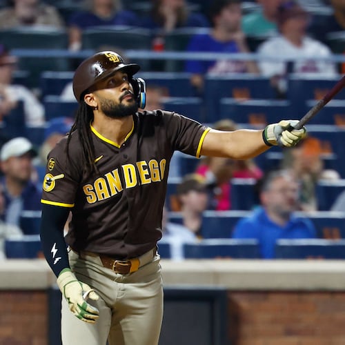 San Diego Padres' Fernando Tatis Jr. follows through on a two run home run against the New York Mets during the fifth inning of a baseball game, Tuesday, Aug. 18, 2026, in New York. (AP Photo/Noah K. Murray)