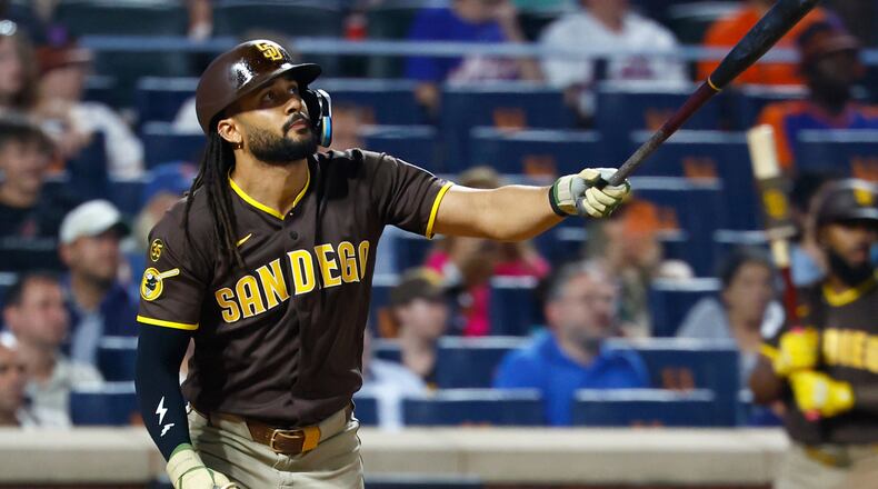 San Diego Padres' Fernando Tatis Jr. follows through on a two run home run against the New York Mets during the fifth inning of a baseball game, Tuesday, Aug. 18, 2026, in New York. (AP Photo/Noah K. Murray)