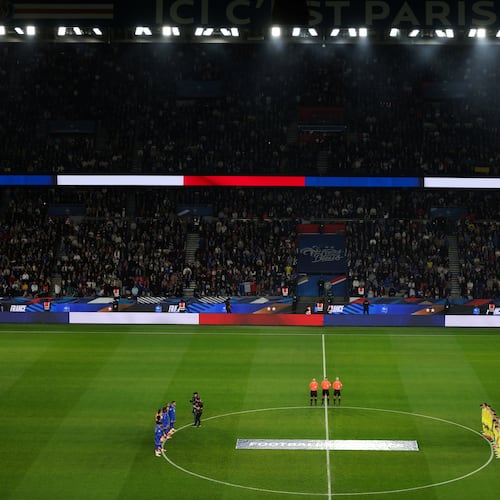 Ukrainian, right, and French players observe a minute of silence in tribute to the victims of the Nov.13, 2015 Paris attacks, ahead of the 2026 World Cup qualifiers Europe zone group D football match between France and Ukraine at the Parc des Princes stadium, Thursday, Nov. 13, 2025 in Paris. ( Franck Fife, Pool photo via AP)