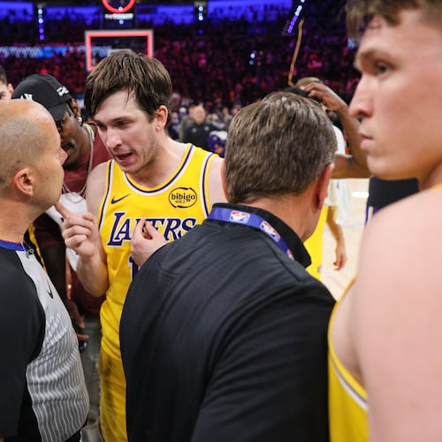Los Angeles Lakers' Austin Reaves, center right, talks with referee John Goble, center, left, after the team's loss in Game 2 in a second-round NBA basketball playoffs series against the Oklahoma City Thunder Thursday, May 7, 2026, in Oklahoma City. (AP Photo/Nate Billings)