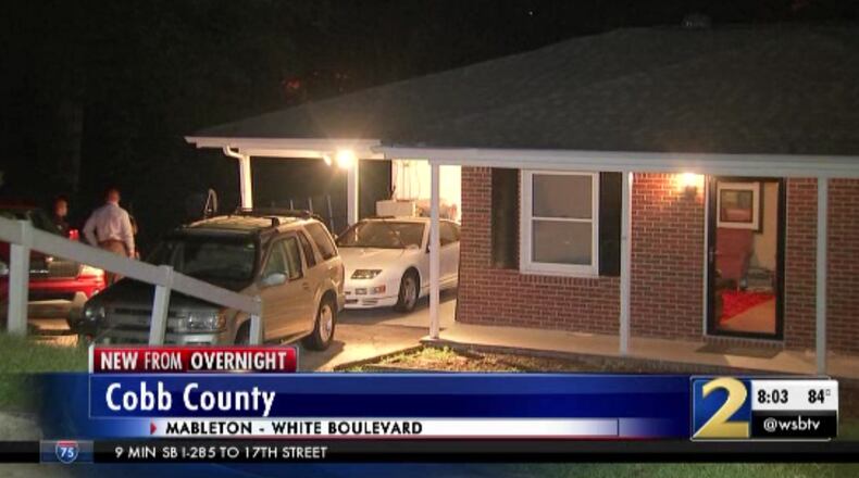 A Cobb child was shot in the stomach by a bullet through a window, police said.