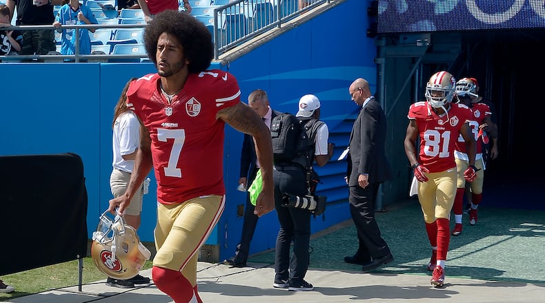 CHARLOTTE, NC - SEPTEMBER 18: Colin Kaepernick #7 of the San Francisco 49ers takes the field to warm up against the Carolina Panthers at Bank of America Stadium on September 18, 2016 in Charlotte, North Carolina. A customer of a Virginia bar has expressed outrage after he said the bar used one of Kaepernick's jerseys, like the one pictured, as a doormat. (Photo by Grant Halverson/Getty Images)