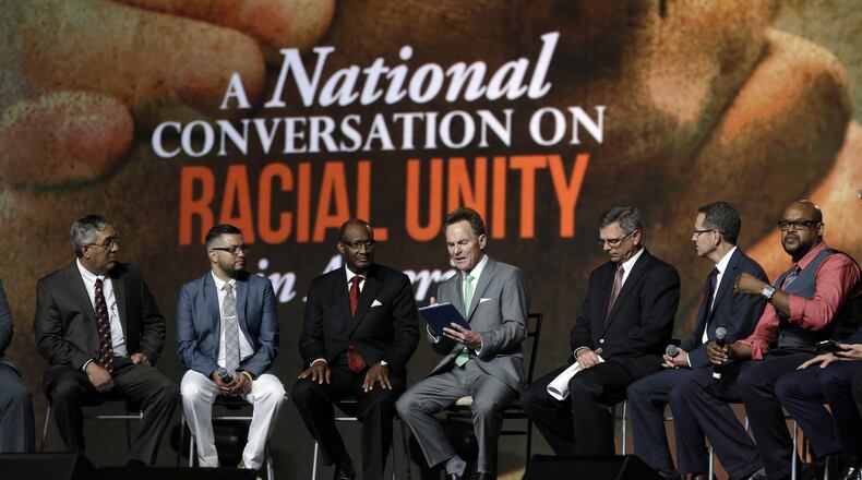 Pastor Ronnie Floyd, center, president of the Southern Baptist Convention, conducts a discussion on race with fellow religious leaders during a meeting of the Southern Baptist Convention on Tuesday, June 14, 2016, in St. Louis. (AP Photo/Jeff Roberson)