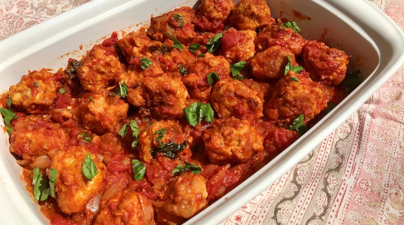 You’ll want to let Polpette Casce e Ovo, or Italian bread “meatballs,” simmer in tomato sauce until they are plump, spongy and tender. LIGAYA FIGUERAS / LFIGUERAS@AJC.COM