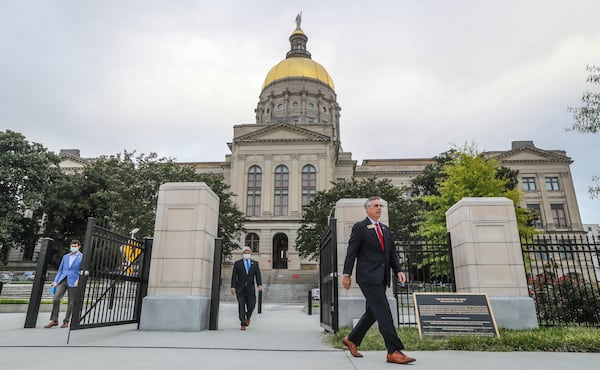 Georgia Secretary of State Brad Raffensperger, right, announced Tuesday that 1,000 Georgians voted twice in the state's June 9 primary, a felony that he said will be prosecuted to the fullest extent of the law. (John Spink / John.Spink@ajc.com)

