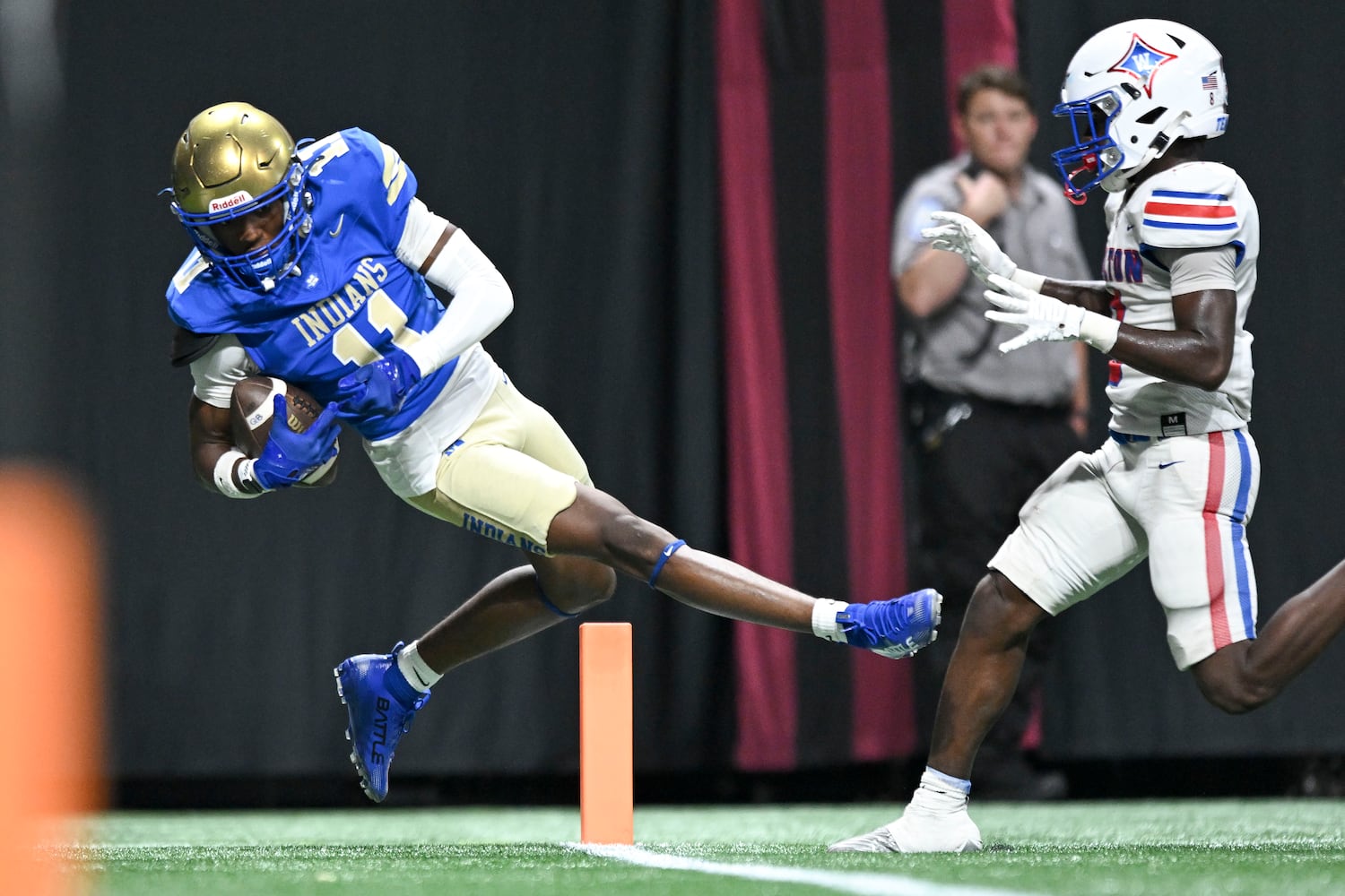 McEachern’s Arinzechi Opene (11) catches in the end zone but falls out of bounds under pressure from a Walton defender during the first half of the Corky Kell Classic football game Saturday, August 16, 2025 at the Mercedes-Benz Stadium. (Daniel Varnado/For the Atlanta Journal-Constitution)