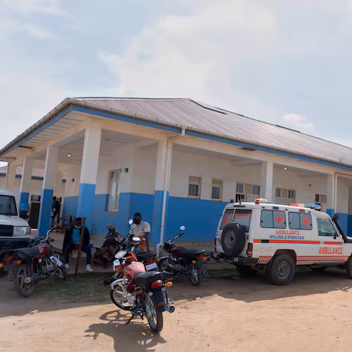 People wait near an ambulance at a hospital in Bunia, Congo, Sunday, May 17, 2026. (AP Photo/ Dirole Lotsima Dieudonne)