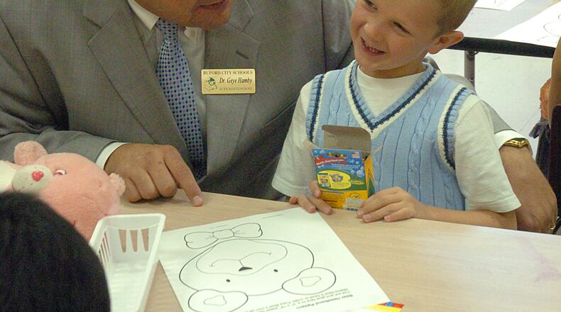 New superintendent, Geye Hamby talking with his son Forbes about his "Teddy Bear" experience  at Buford Elementary School. (NICK ARROYO/AJC staff)