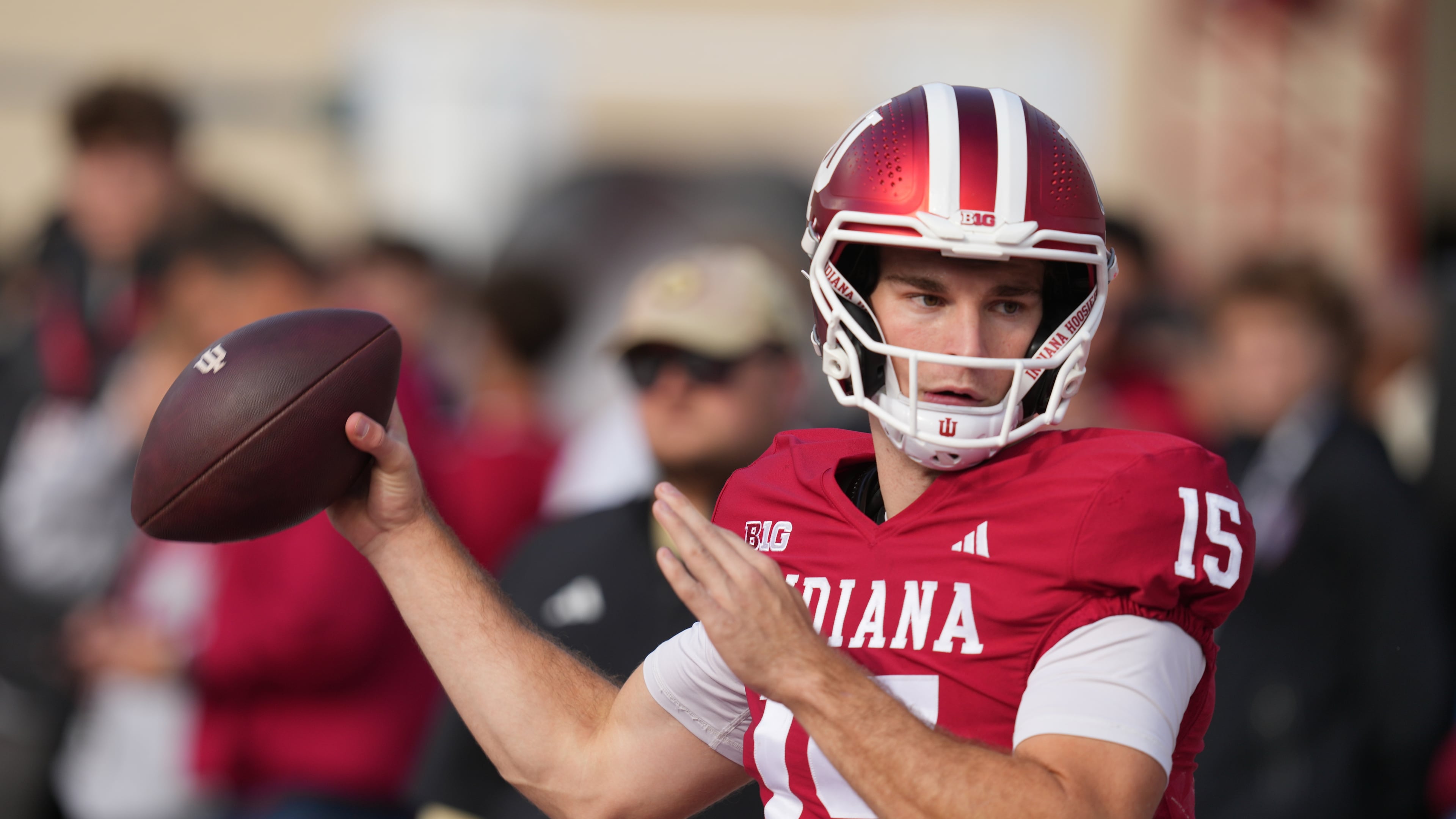 Indiana quarterback Fernando Mendoza throws before an NCAA college football game against Wisconsin, Saturday, Nov. 15, 2025, in Bloomington, Ind. (AP Photo/Darron Cummings)
