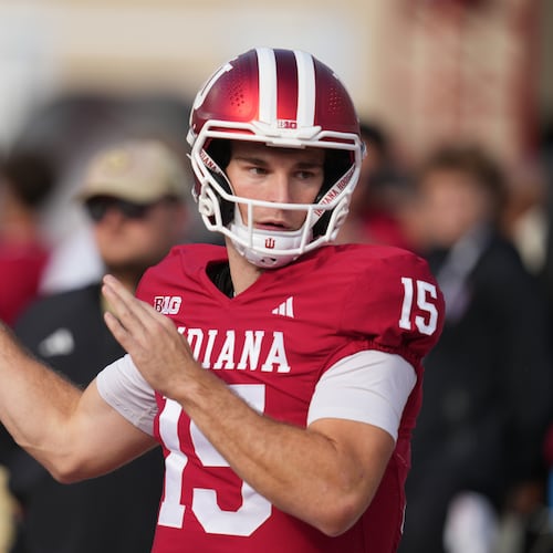 Indiana quarterback Fernando Mendoza throws before an NCAA college football game against Wisconsin, Saturday, Nov. 15, 2025, in Bloomington, Ind. (AP Photo/Darron Cummings)