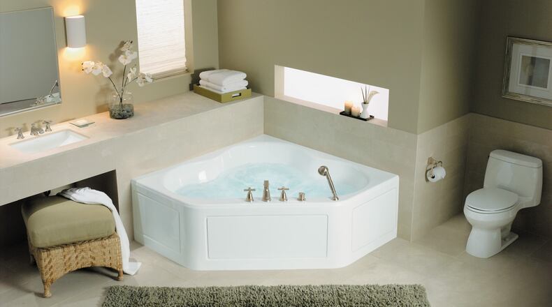 Corner install tubs can be a little larger than a standard tub, and with the finished apron-front side, you may open up even more bathroom space. (Kohler)