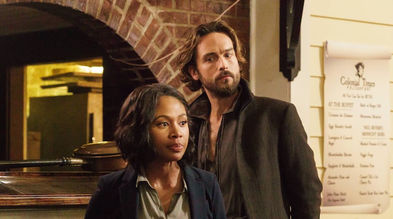 SLEEPY HOLLOW: Ichabod Crane (Tom Mison, L) and Abbie (Nicole Beharie, R) try to come up with a plan in the "I, Witness" season two premiere episode of SLEEPY HOLLOW airing Monday, Oct. 1 (9:00-10:00 PM ET/PT) on FOX. ©2014 Fox Broadcasting Co. CR: Tina Rowden/FOX