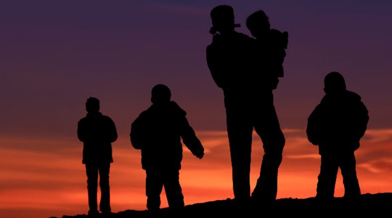 Family in silhouette (ImagineGolf / iStock / Getty Images Plus)