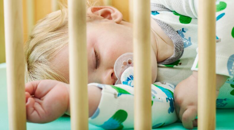 Baby sleeping in crib
