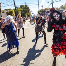 Creatively creepy costumes — such as the one worn by Lily Leeshanok, front right — add to the fun spectacle of the Little Five Points Halloween Parade.