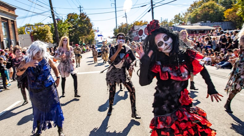 Creatively creepy costumes -- such as the one worn by Lily Leeshanok (front right) -- add to the fun spectacle of the Little Five Points Halloween Parade. The next parade takes place at 2 p.m. on Oct. 20. (Jenni Girtman for the AJC)