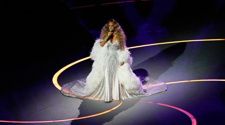 Singer Mariah Carey performs during the Olympic opening ceremony at the 2026 Winter Olympics, in Milan, Italy, Friday, Feb. 6, 2026. (AP Photo/Petr David Josek)
