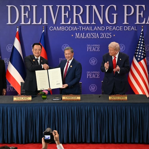 FILE - Malaysia's Prime Minister Anwar Ibrahim, left, and U.S. President Donald Trump, right, watch as Thailand's Prime Minister Anutin Charnvirakul, second left, and Cambodia's Prime Minister Hun Manet hold up a document after the ceremonial signing of a ceasefire agreement between Thailand and Cambodia on the sidelines of the 47th Association of Southeast Asian Nations (ASEAN) summit in Kuala Lumpur, Malaysia, on Oct. 26, 2025. (Mohd Rasfan/Pool Photo via AP, File)