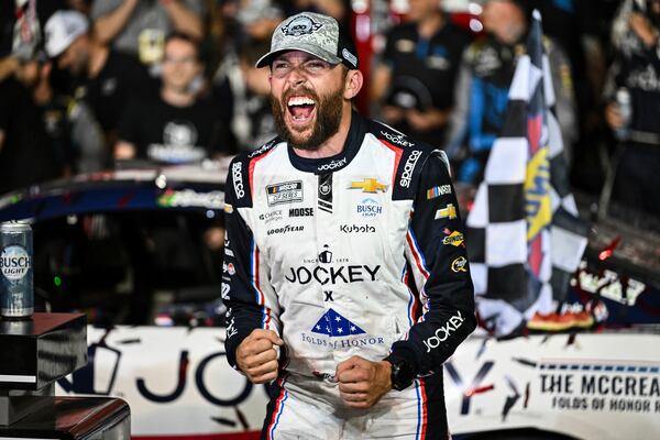 Ross Chastain celebrates in Victory Lane after winning a NASCAR Cup Series auto race at Charlotte Motor Speedway, Sunday, May 25, 2025, in Concord, N.C. (AP Photo/Matt Kelley)