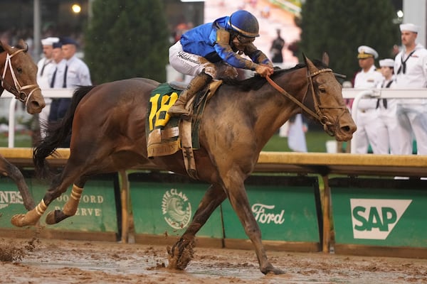 Sovereignty, ridden by Junior Alvarado, crosses the finish line to win the 151st running of the Kentucky Derby horse race at Churchill Downs Saturday, May 3, 2025, in Louisville, Ky. (AP Photo/Jeff Roberson)
