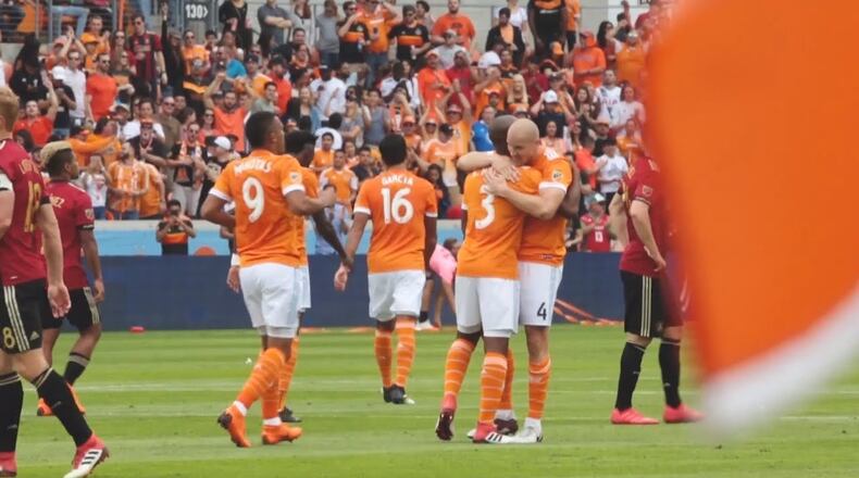 Houston's Philippe Senderos is congratulated after scoring a goal against Atlanta United on Saturday.