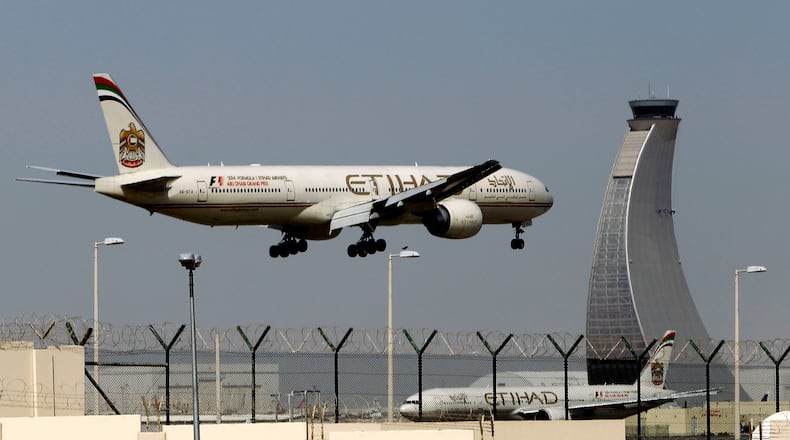 An Etihad Airways aircraft plan prepares to land at the Abu Dhabi airport, in United Arab Emirates, Sunday, May 4, 2014. (AP Photo/Kamran Jebreili)