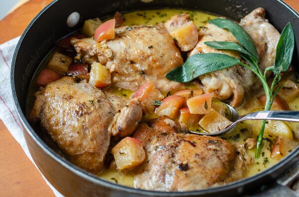 French Chicken with Apples and Cream is rich and indulgent with chunks of apples bobbing in a cream-enriched jus. (Virginia Willis for the AJC)