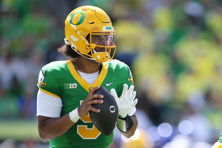 Oregon quarterback Dante Moore (5) looks to pass during the first half of an NCAA college football game against Boise State, Saturday, Sept. 5, 2026, in Eugene, Ore. (AP Photo/Lydia Ely)