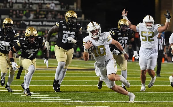 Georgia Tech quarterback Haynes King runs for a touchdown against Colorado on Friday, Aug. 29, 2025, in Boulder, Colo. King led the Yellow Jackets to a win, knowing his father is battling a recent cancer diagnosis. (David Zalubowski/AP)
