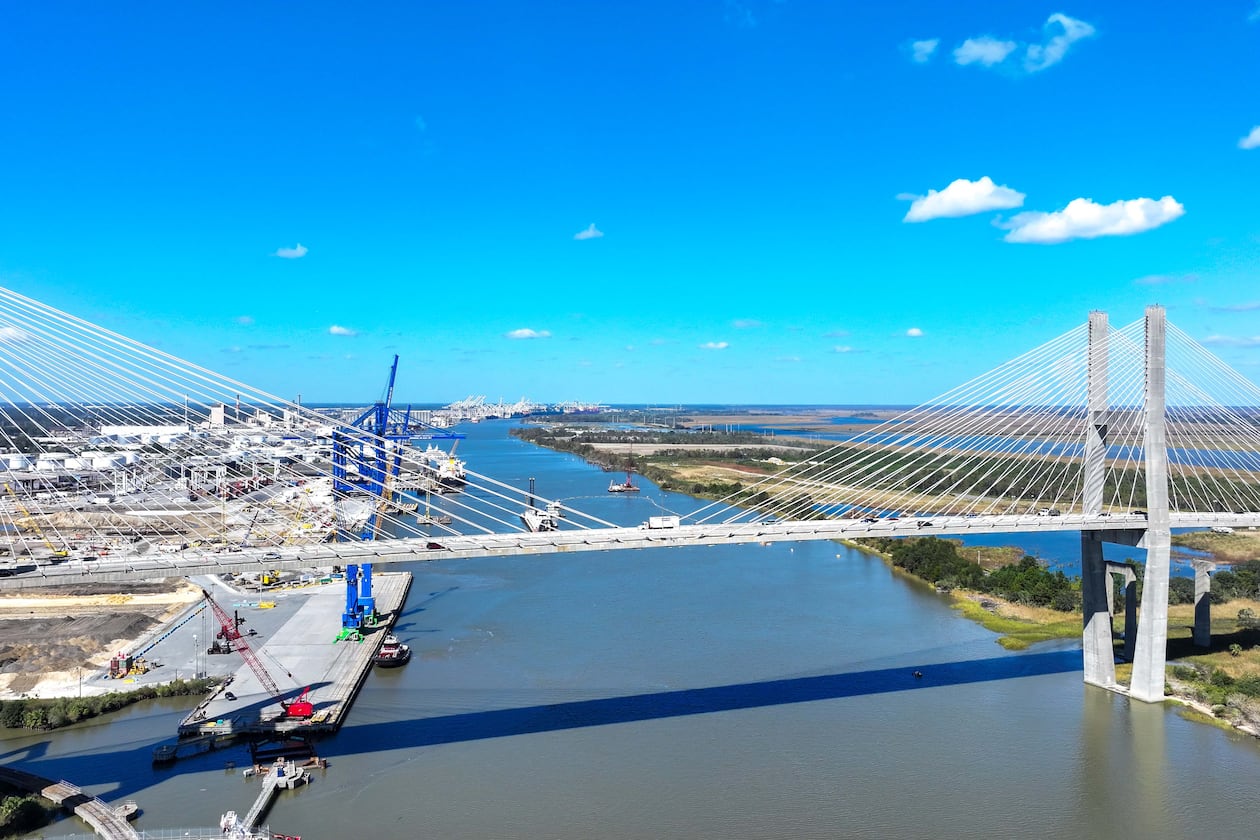 An aerial image of the Talmadge Bridge above the Savannah River with the Georgia Ports Authority Ocean Terminal in the background is seen on Wednesday, Oct. 23, 2024. (Miguel Martinez/AJC)