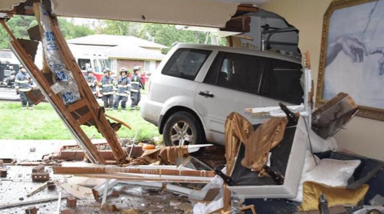 A woman driving an SUV crashed into an Indianapolis home early Monday.