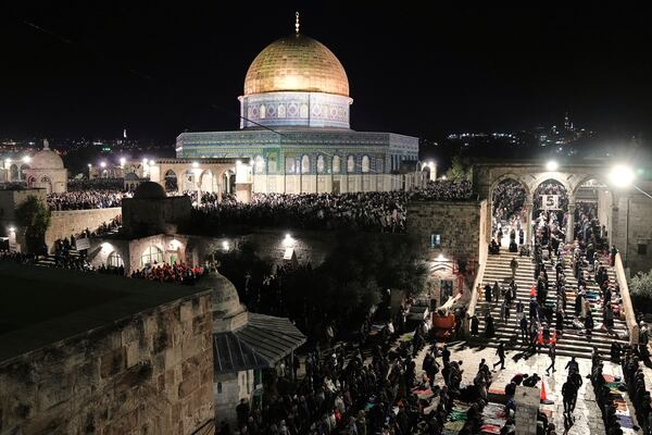 Palestinian Muslim worshippers pray during Laylat Al Qadr, also known as the Night of Power and marked on the 27th day of the holy fasting month of Ramadan, in front of the Dome of the Rock shrine at the Al-Aqsa Mosque compound in the Old City of Jerusalem, Wednesday, March 26, 2025. (AP Photo/Mahmoud Illean)