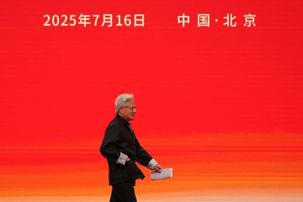 President and CEO of Nvidia Corporation Jensen Huang heads to deliver his speech for the opening ceremony of the 3rd China International Supply Chain Expo in Beijing, Wednesday, July 16, 2025. (AP Photo/Andy Wong)