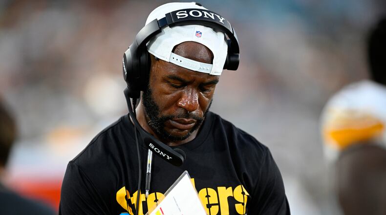 FILE - Then-Pittsburgh Steelers defensive backs coach Gerald Alexander writes down notes on the sideline during the first half of an NFL preseason football game against the Jacksonville Jaguars, Aug. 9, 2025, in Jacksonville, Fla. (AP Photo/Phelan M. Ebenhack, File)