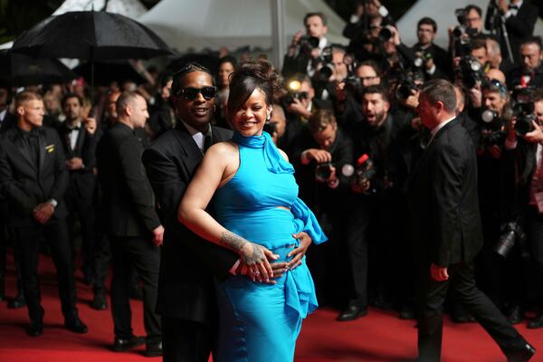 A$AP Rocky, left, and Rihanna pose for photographers upon departure from the premiere of the film 'Highest 2 Lowest' at the 78th international film festival, Cannes, southern France, Monday, May 19, 2025. (Photo by Lewis Joly/Invision/AP)
