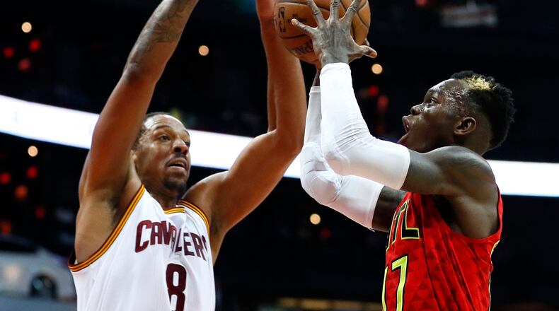 Atlanta Hawks guard Dennis Schroder (17) goes up for a shot as Cleveland Cavaliers forward Channing Frye (8) defends in the first half of an NBA basketball game, Sunday, April 9, 2017, in Atlanta. (AP Photo/Todd Kirkland)