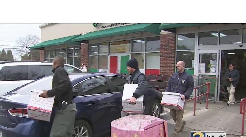 Federal agents executed search warrants at six Super Mercado Jalisco stores in Duluth, Marietta, Norcross, Lawrenceville and Roswell Thursday, taking documents and computers.
