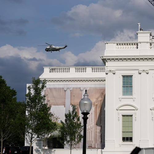 A helicopter from Marine Helicopter Squadron One, or HMX-1, flies past the White House after President Donald Trump arrived at the Ellipse near the White House, Friday, Aug. 28, 2026, in Washington, on return from Houston. (AP Photo/Jacquelyn Martin)