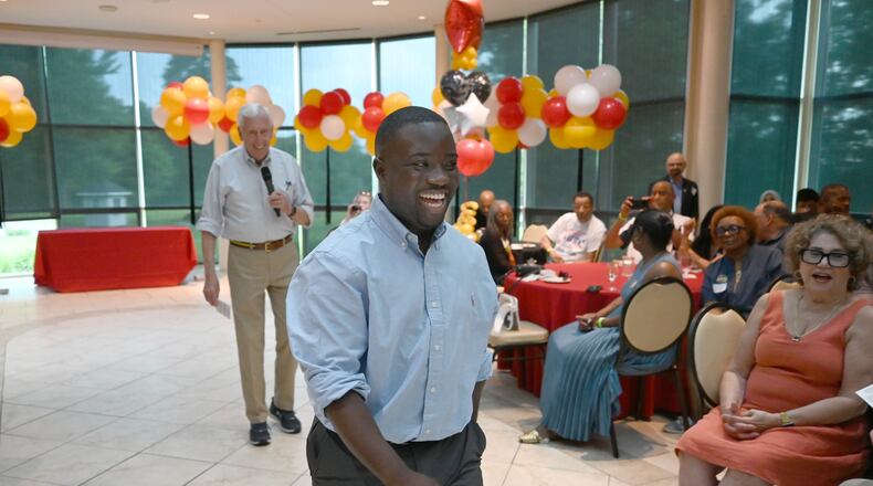 Adrian Boafo, a Maryland state delegate and candidate for U.S. Congress walks into the crowd after being introduced by Congressman Steny Hoyer, left, at the "AmeriPac Bull Roast" Friday, June 12, 2026, in Mitchellville, Md. (AP Photo/Gail Burton)