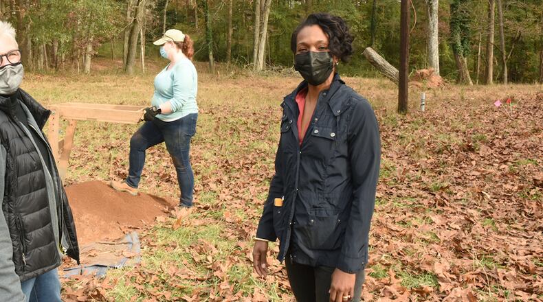 (L-R) Pat Burns of the Friends of the Concord Covered Bridge Historic District board and soon-to-be Cobb Commission Chair Lisa Cupid help with the archaeological dig of a Civil War battlefield site near Smyrna.