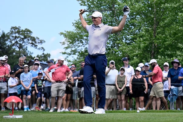 Jordan Spieth stretches at the first hole during the first round of the Travelers Championship golf tournament at TPC River Highlands, Thursday, June 19, 2025, in Cromwell, Conn. (AP Photo/Jessica Hill)