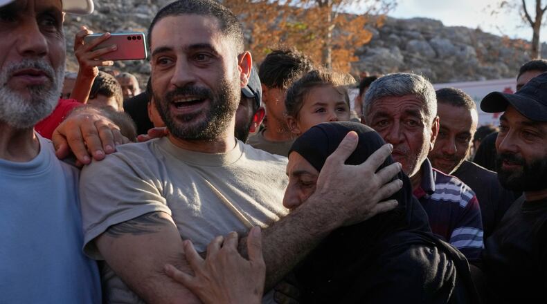 Hussein Ayash, who was released from an Israeli prison, hugs his mother as he arrives at his family home in the southern village of Harouf, Lebanon, Friday, Sept. 4, 2026. (AP Photo/Mohammed Zaatari)