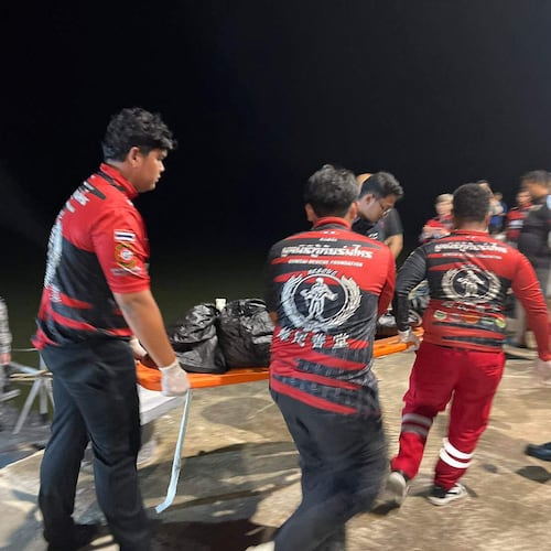 In this image released by Romsai Rescue Foundation Satun, Thai Navy carry a body which is believed to be one of passengers from a boat that believed sank near Tarutao island, Satun, southern Thailand, Sunday, Nov. 9, 2025. (Romsai Rescue Foundation Satun via AP)