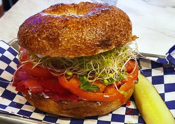 The Fishmonger is a bagel sandwich with smoked, cured salmon. Henri Hollis/henri.hollis@ajc.com