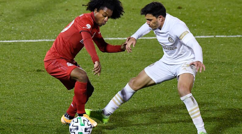 Toronto FC's Jayden Nelson (left) controls the ball as Atlanta United's Fernando Meza defends during the second half Sunday, Oct. 18, 2020, in East Hartford, Conn. (Jessica Hill/AP)