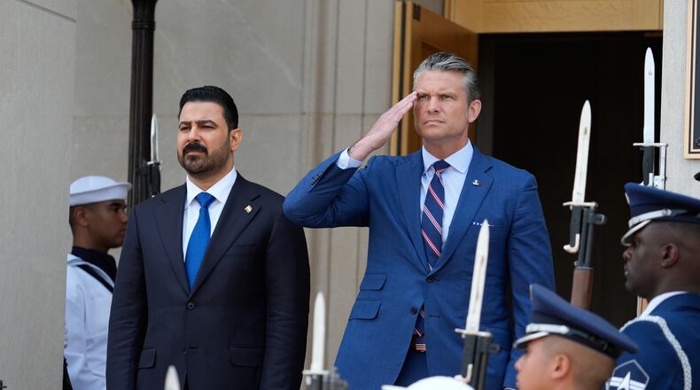 Secretary of Defense Pete Hegseth, right, welcomes Iraqi Prime Minister Ali al-Zaidi, to the Pentagon, during a ceremony, Tuesday, July 14, 2026, in Washington. (AP Photo/Manuel Balce Ceneta)