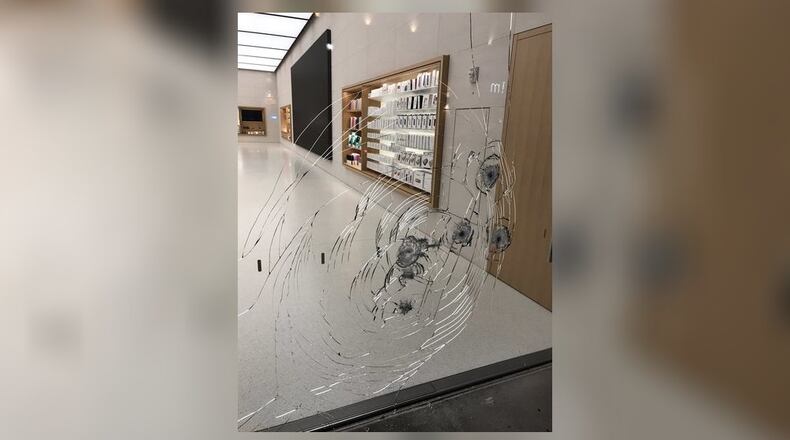 Alpharetta police are searching for thieves they say cracked the glass of an Apple store. (Credit: Channel 2 Action News)