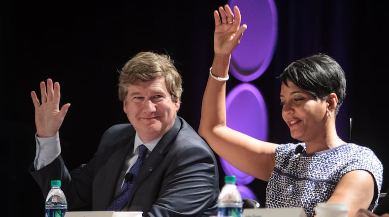 Atlanta mayoral candidates Peter Aman and Keisha Lance Bottoms answer questions at a forum. STEVE SCHAEFER / SPECIAL TO THE AJC