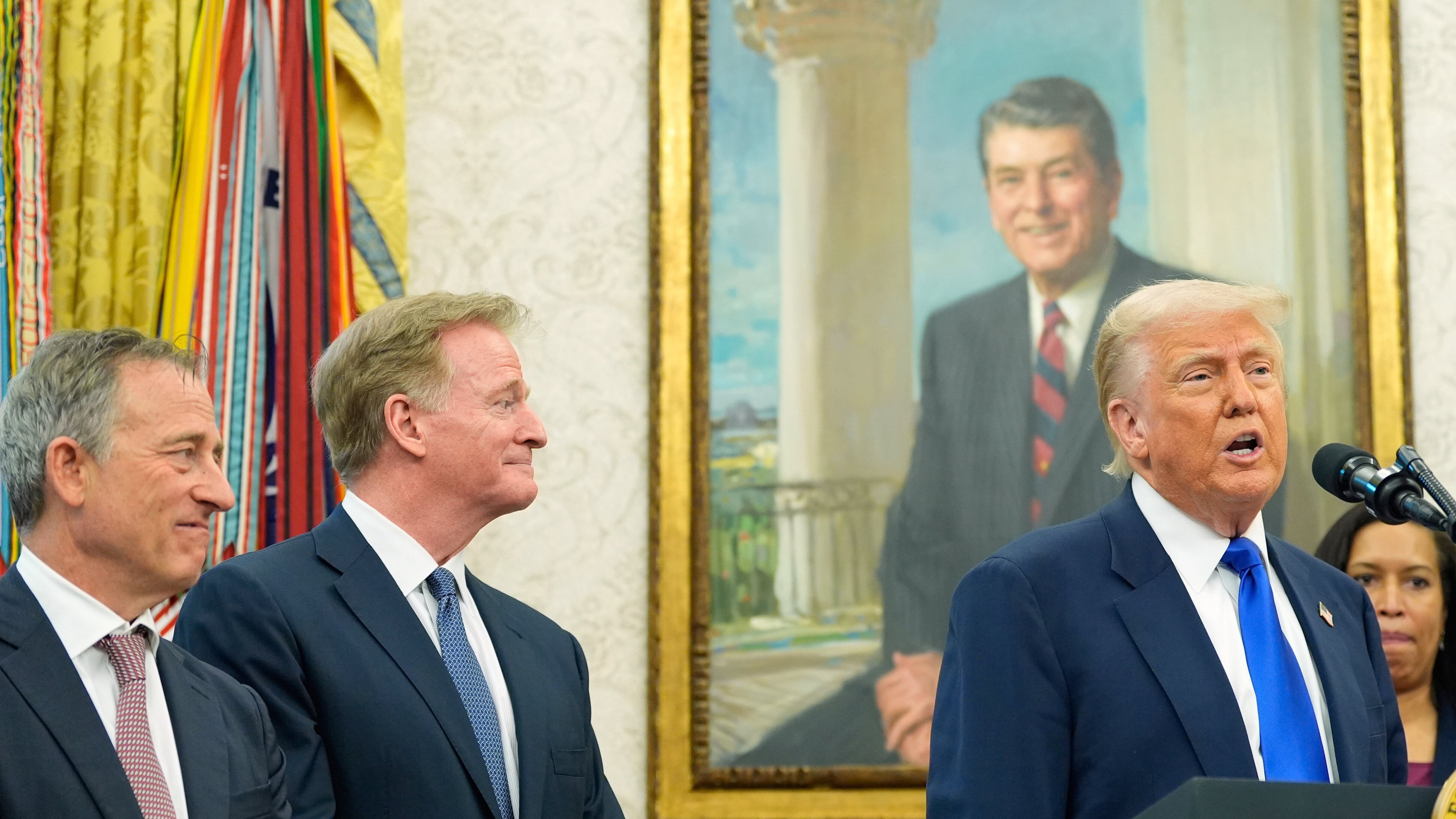 FILE - President Donald Trump speaks as Washington Commanders owner Josh Harris, from left, NFL Commissioner Roger Goodell and District of Columbia Mayor Muriel Bowser listen during an event in the Oval Office of the White House, May 5, 2025, in Washington. (AP Photo/Alex Brandon, File)
